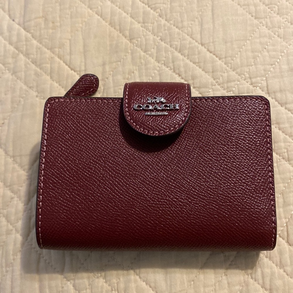 Coach medium zip corner wallet bill fold and coin holder. Burgundy in color